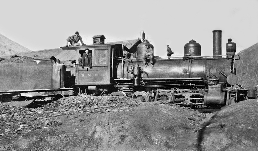 Silverton Northern Railroad locomotive #3, with tender, standing on siding south of Silverton Northern Machine Shop.